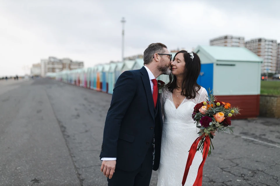 Jodie and Gregg kissing beside the Hove beach huts — Brighton